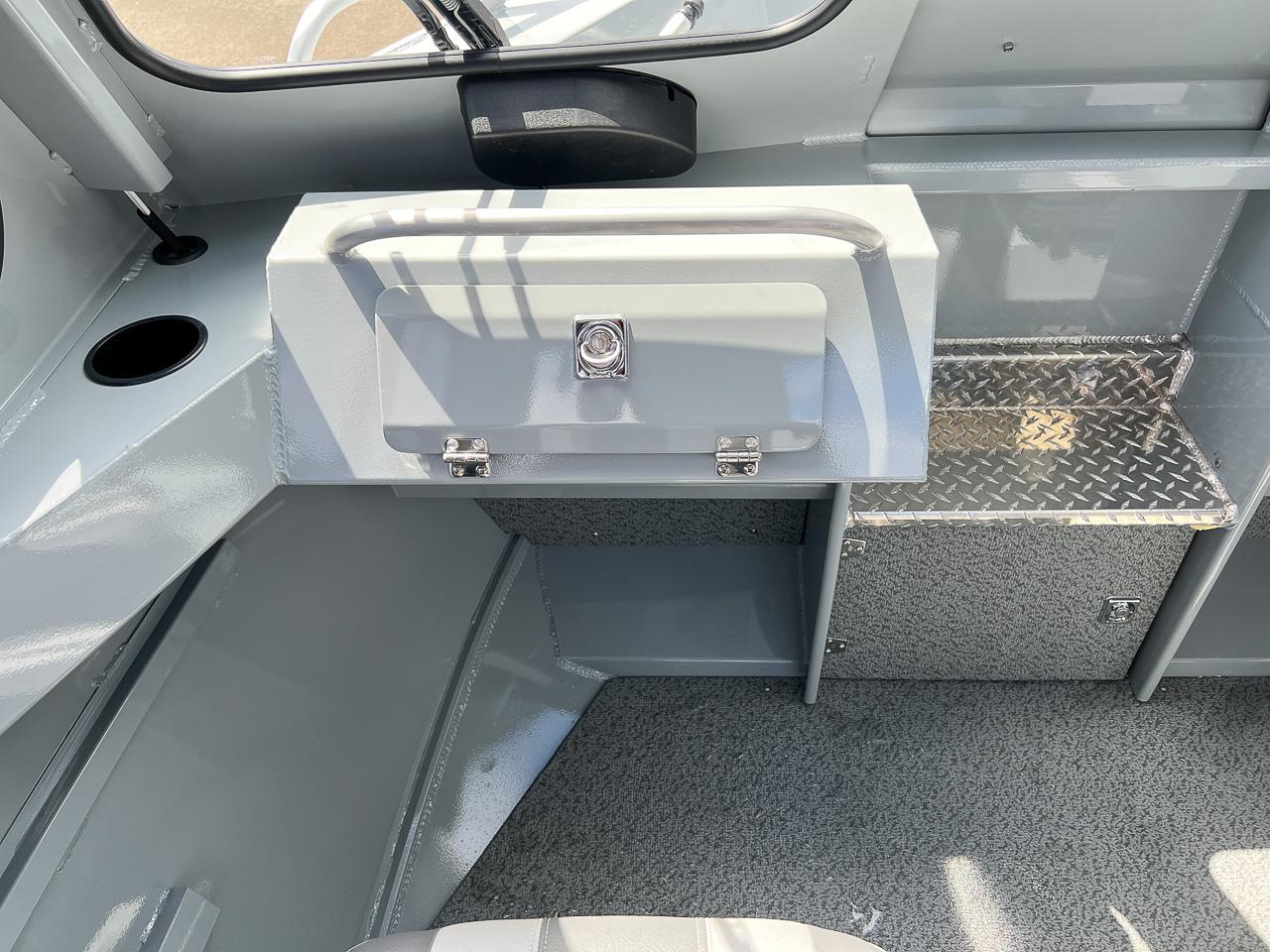 Slide: The Image of Interior of 2023 Hewescraft 200 Pro-V ET HT boat with storage compartments. - 9