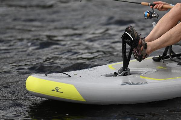 Slide: The Image of Hobie iTrek 9 Ultralight 2023 inflatable kayak on water with pedal drive system. - 13