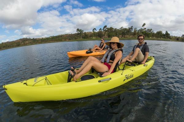 Slide: The Image of People kayaking on a lake in a 2022 Hobie Mirage Oasis. - 1