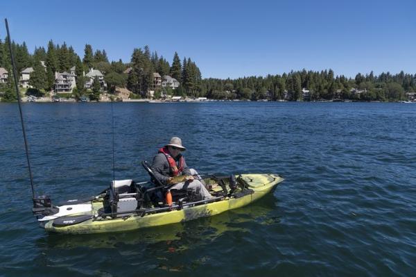 Slide: The Image of Man fishing on a 2023 Hobie Mirage Pro Angler 12 kayak with 360 Drive Technology. - 0