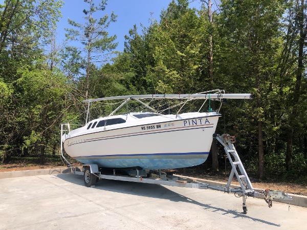 Slide: The Image of Sailboat on trailer, 1998 Hunter 240 model, surrounded by trees. - 1