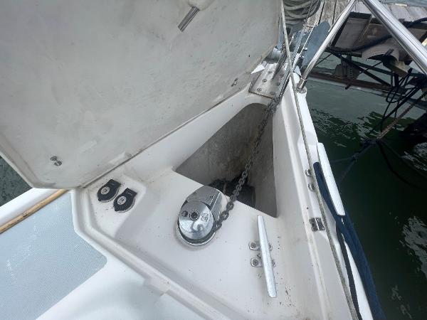 Slide: The Image of Anchor locker of a 2000 Hunter 410 sailboat with chain and winch. - 16