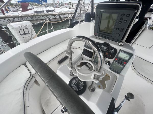 Slide: The Image of Cockpit of 2000 Hunter 410 sailboat with navigation instruments and steering wheel. - 23