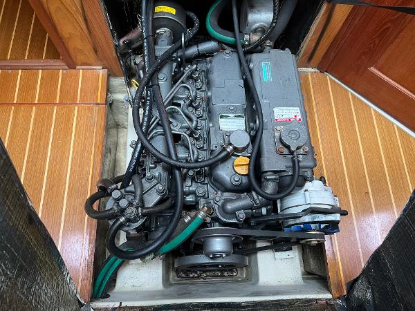 Slide: The Image of Engine compartment of a 2000 Hunter 410 sailboat, showcasing detailed mechanical components. - 45