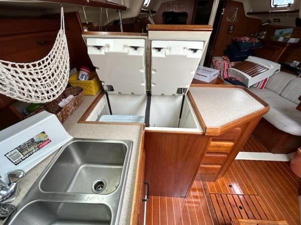 Slide: The Image of Interior of 1992 Hunter Legend 37 sailboat with open fridge and double sink. - 10