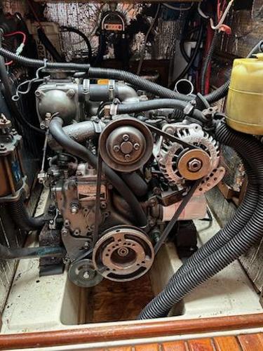 Slide: The Image of 1992 Hunter Legend 37 engine compartment with visible belts and hoses. - 17