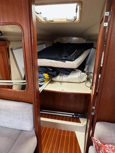Slide: The Image of Interior cabin of a 1992 Hunter Legend 37 sailboat with wooden finishes. - 19