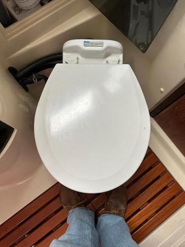 Slide: The Image of 1992 Hunter Legend 37 boat toilet with wooden floor panels. - 24