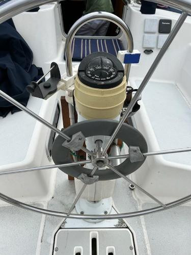 Slide: The Image of Steering wheel and compass of a 1992 Hunter Legend 37 sailboat. - 3