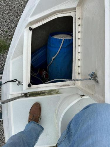 Slide: The Image of 1992 Hunter Legend 37 sailboat storage compartment with blue bag and gear. - 31