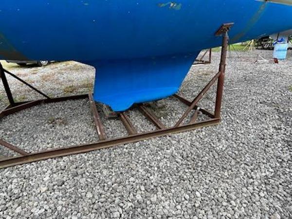 Slide: The Image of 1992 Hunter Legend 37 sailboat keel on a metal stand. - 35