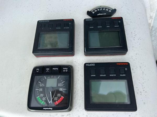Slide: The Image of Hunter Legend 37 1992 sailboat navigation instruments: wind, speed, depth, and angle gauges. - 6