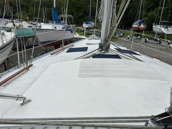 Slide: The Image of 1992 Hunter Legend 37 sailboat on dry dock with other boats. - 8