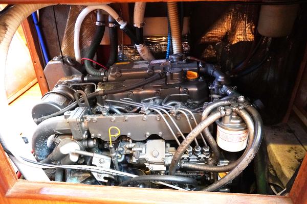 Slide: The Image of Engine compartment of a 2000 Hunter Passage 420 sailboat, showcasing intricate mechanical components. - 15