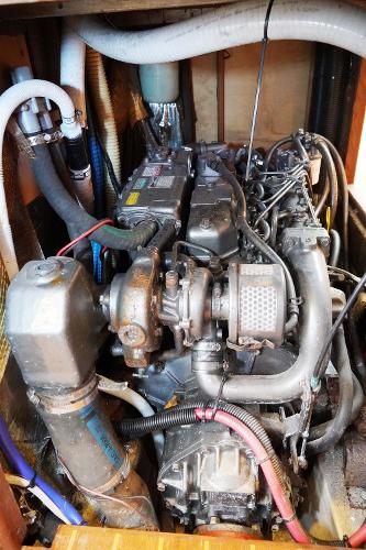 Slide: The Image of Engine compartment of a 2000 Hunter Passage 420 sailboat, showcasing detailed mechanical components. - 16