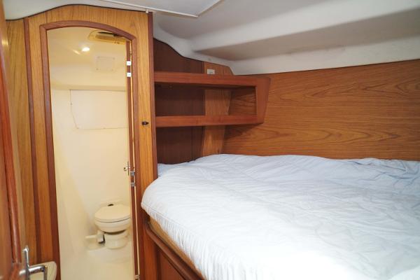 Slide: The Image of Cozy cabin interior of 2000 Hunter Passage 420 yacht with bed and bathroom. - 20