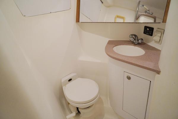 Slide: The Image of Bathroom interior of 2000 Hunter Passage 420 yacht, featuring toilet and sink. - 27