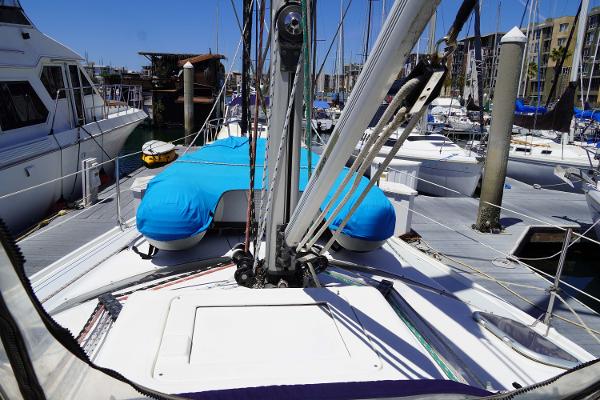 Slide: The Image of Hunter Passage 420 sailboat, 2000 model, docked in a marina with blue covers. - 8