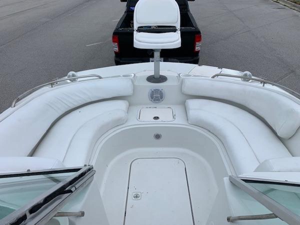 Slide: The Image of 2004 Hurricane 187SD boat with white seating and a fishing chair. - 10