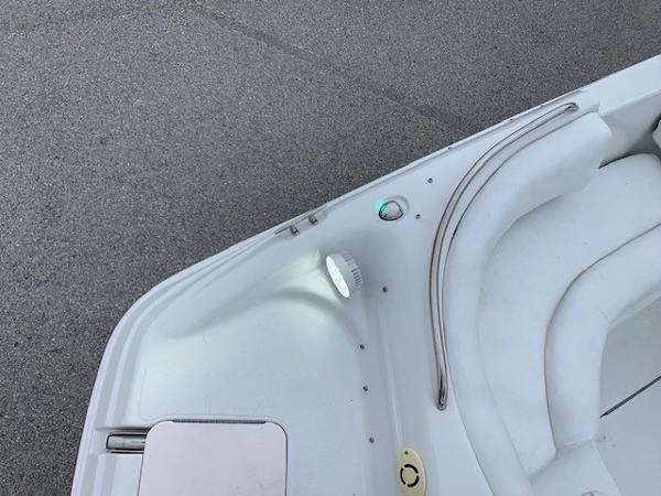 Slide: The Image of 2004 Hurricane 187SD boat interior, white seating and deck details. - 11