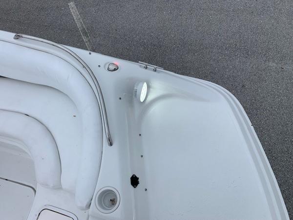 Slide: The Image of 2004 Hurricane 187SD boat interior with seating and light. - 12
