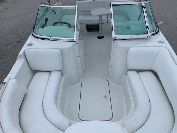 Slide: The Image of 2004 Hurricane 187SD boat interior with white seating and windshield. - 13