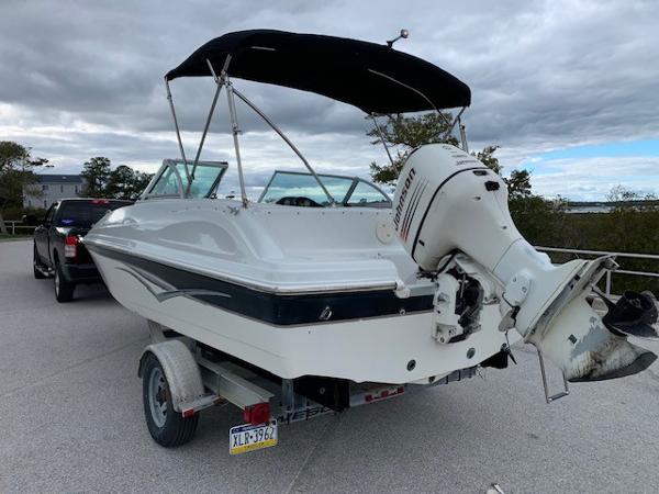 Slide: The Image of 2004 Hurricane 187SD boat on trailer with outboard motor. - 5