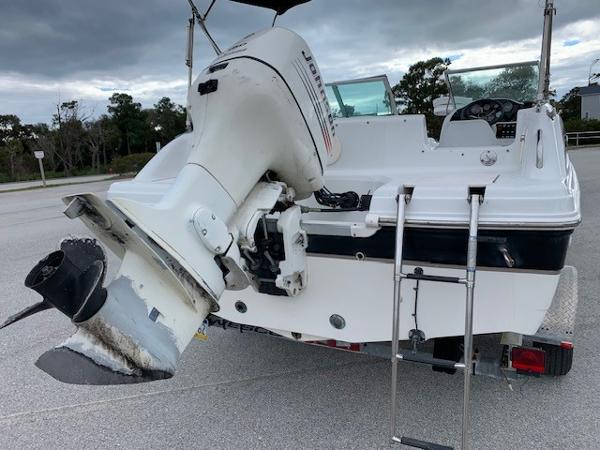 Slide: The Image of 2004 Hurricane 187SD boat with outboard motor and ladder. - 6
