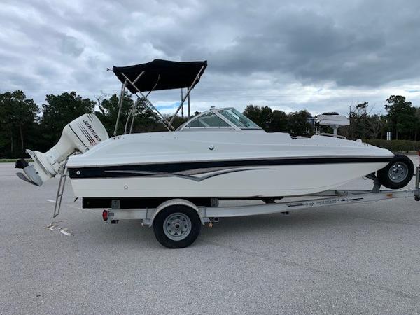 Slide: The Image of 2004 Hurricane 187SD boat on trailer with outboard motor and canopy. - 8