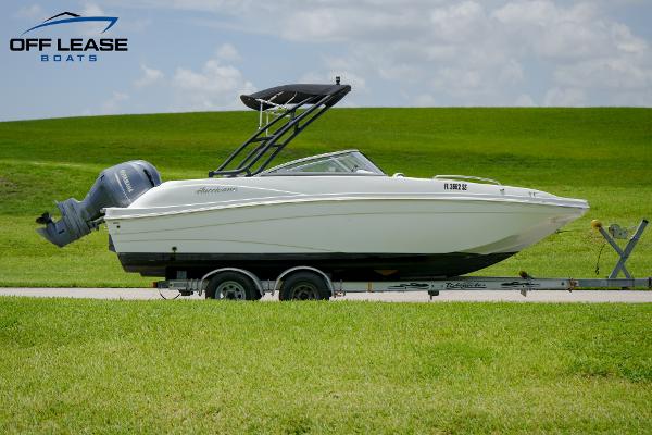 Slide: The Image of 2020 Hurricane 217 SD boat on trailer with outboard motor. - 1