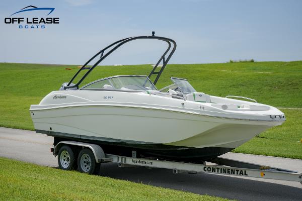 Slide: The Image of 2020 Hurricane 217 SD boat on trailer, displayed outdoors with green grass background. - 2