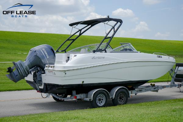 Slide: The Image of 2020 Hurricane 217 SD boat on trailer with Yamaha outboard motor. - 2