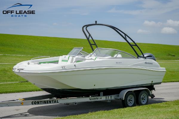 Slide: The Image of 2020 Hurricane 217 SD boat on trailer, displayed outdoors with green grass background. - 7