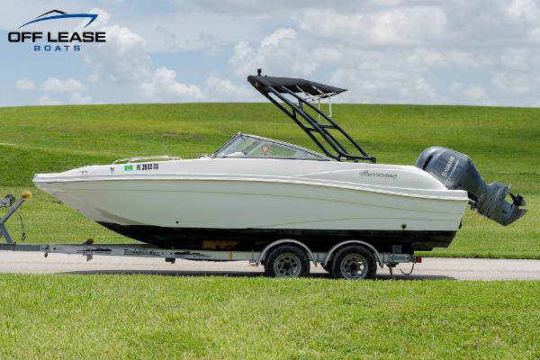 Slide: The Image of 2020 Hurricane 217 SD boat on trailer with outboard motor. - 8