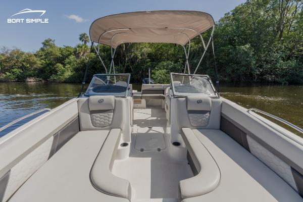 Slide: The Image of 2022 Hurricane 217 SD boat interior with canopy on a calm river. - 9