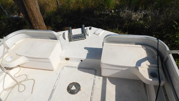 Slide: The Image of 2006 Hurricane 22 Deck Boat stern view with seating and ladder. - 12