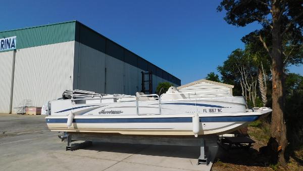 Slide: The Image of 2006 Hurricane 22 Deck Boat on dry dock near marina. - 2