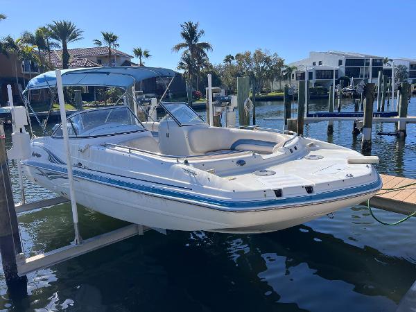 Slide: The Image of 2007 Hurricane 237 Sundeck Yamaha F250 boat docked at marina. - 1