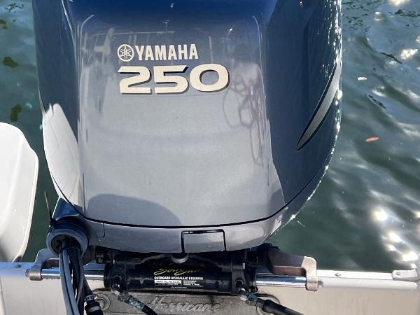 Slide: The Image of Close-up of a Yamaha 250 outboard motor on a 2007 Hurricane 237 Sundeck boat. - 13