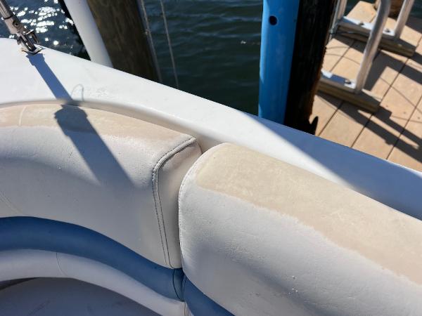 Slide: The Image of 2007 Hurricane 237 Sundeck Yamaha F250 boat seating detail at dock. - 15