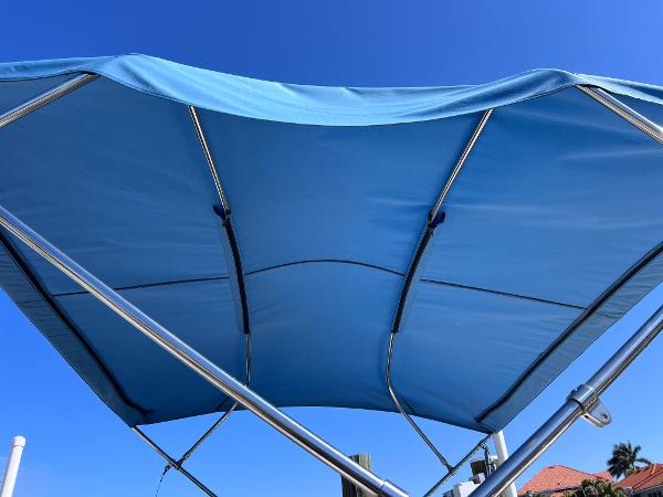 Slide: The Image of Blue canopy of 2007 Hurricane 237 Sundeck Yamaha F250 boat against clear sky. - 20