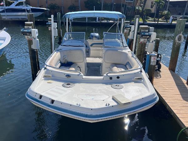 Slide: The Image of 2007 Hurricane 237 Sundeck Yamaha F250 boat docked at marina. - 3