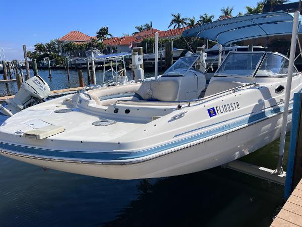 Slide: The Image of 2007 Hurricane 237 Sundeck Yamaha F250 boat docked at marina. - 4