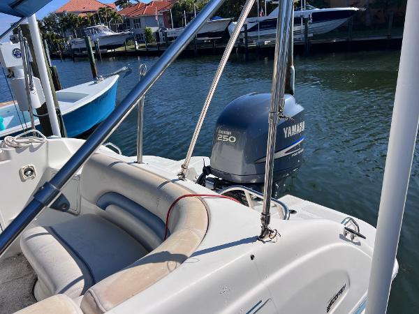 Slide: The Image of 2007 Hurricane 237 Sundeck with Yamaha F250 outboard motor docked by the water. - 6