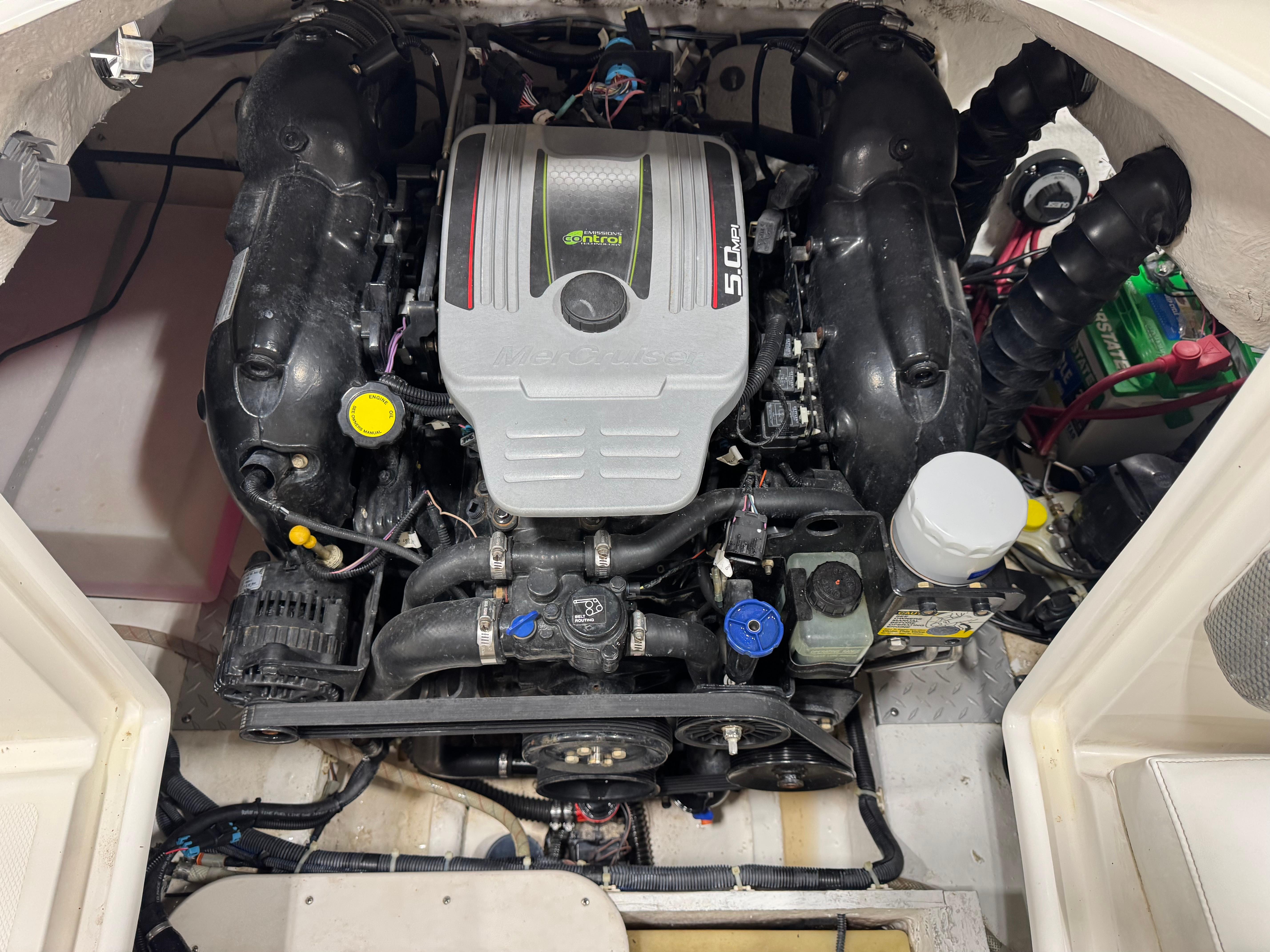 Slide: The Image of Engine compartment of a 2011 Hurricane SD217 boat, featuring a MerCruiser 5.0 MPI engine. - 10
