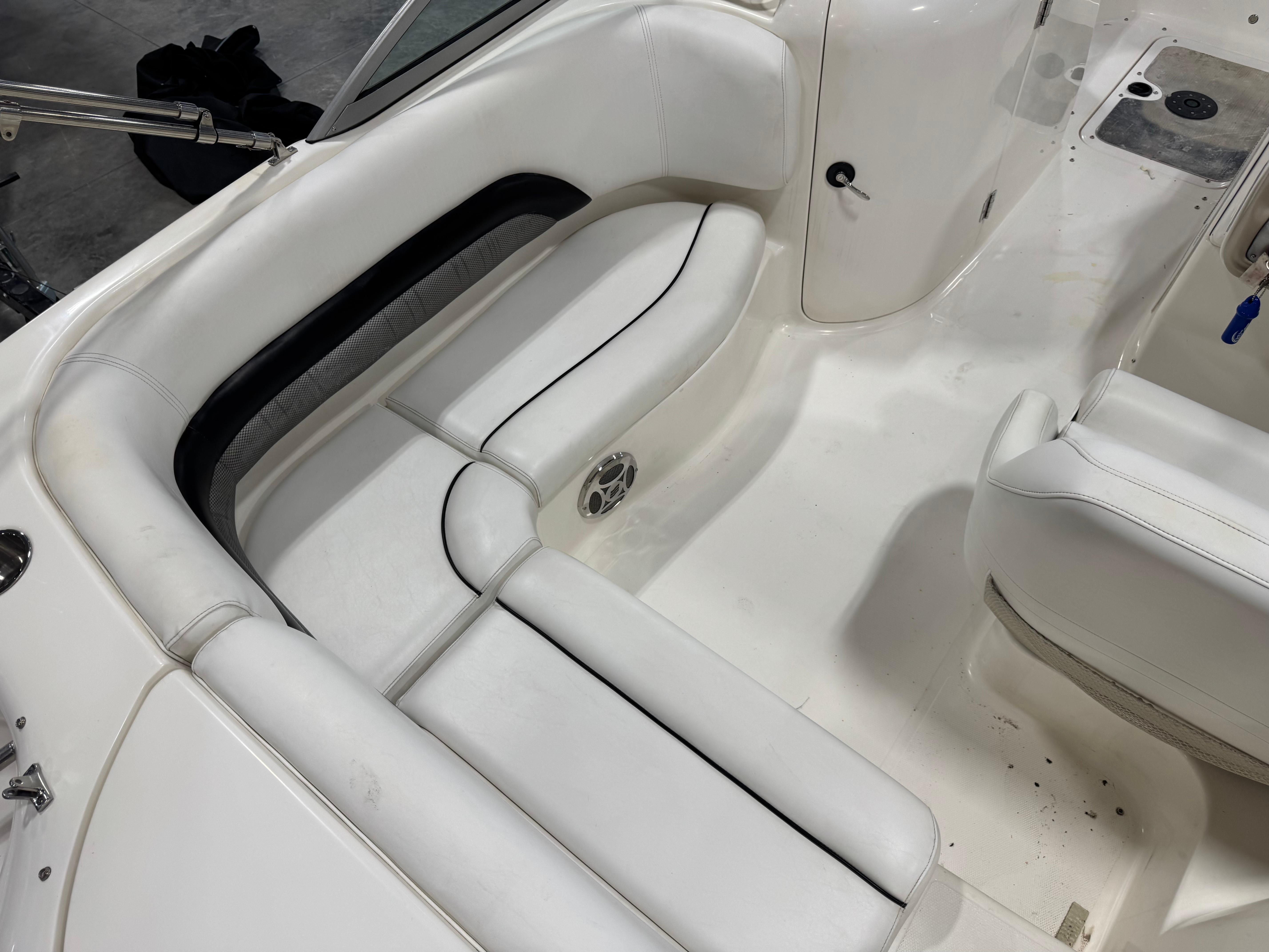 Slide: The Image of Interior of a 2011 Hurricane SD217 boat with white cushioned seating. - 5