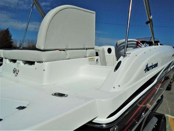 Slide: The Image of 2019 Hurricane SS188 boat with white seating and sleek design under a clear blue sky. - 6