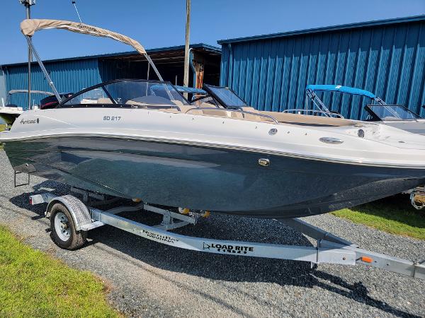 Slide: The Image of 2024 Hurricane SunDeck 217 OB boat on a Load Rite trailer. - 0