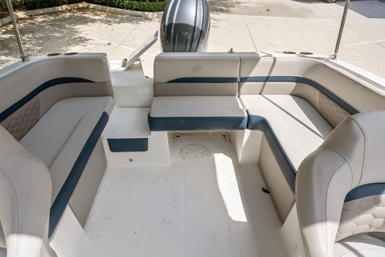 Slide: The Image of 2025 Hurricane SunDeck 217 OB boat interior with spacious seating and modern design. - 9