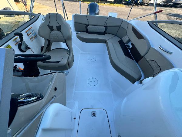 Slide: The Image of 2023 Hurricane SunDeck 2200 DC OB interior with seating and steering wheel. - 13